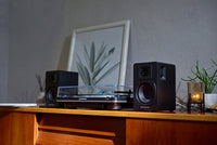 Audio-Technica AT-SP3X black powered speakers lifestyle view