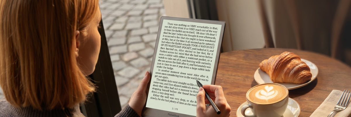 PocketBook InkPad One E-Reader - Matte Black - reading with a coffee