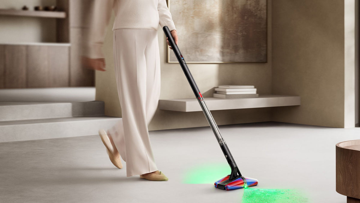 Dyson PencilVac Fluffycones Cordless Vacuum Cleaner - Matte Black - illuminating dust on a hard floor