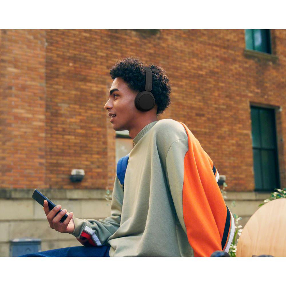 Sony WH-CH520 Wireless On-Ear Headphones - Black - wearing lifestyle view