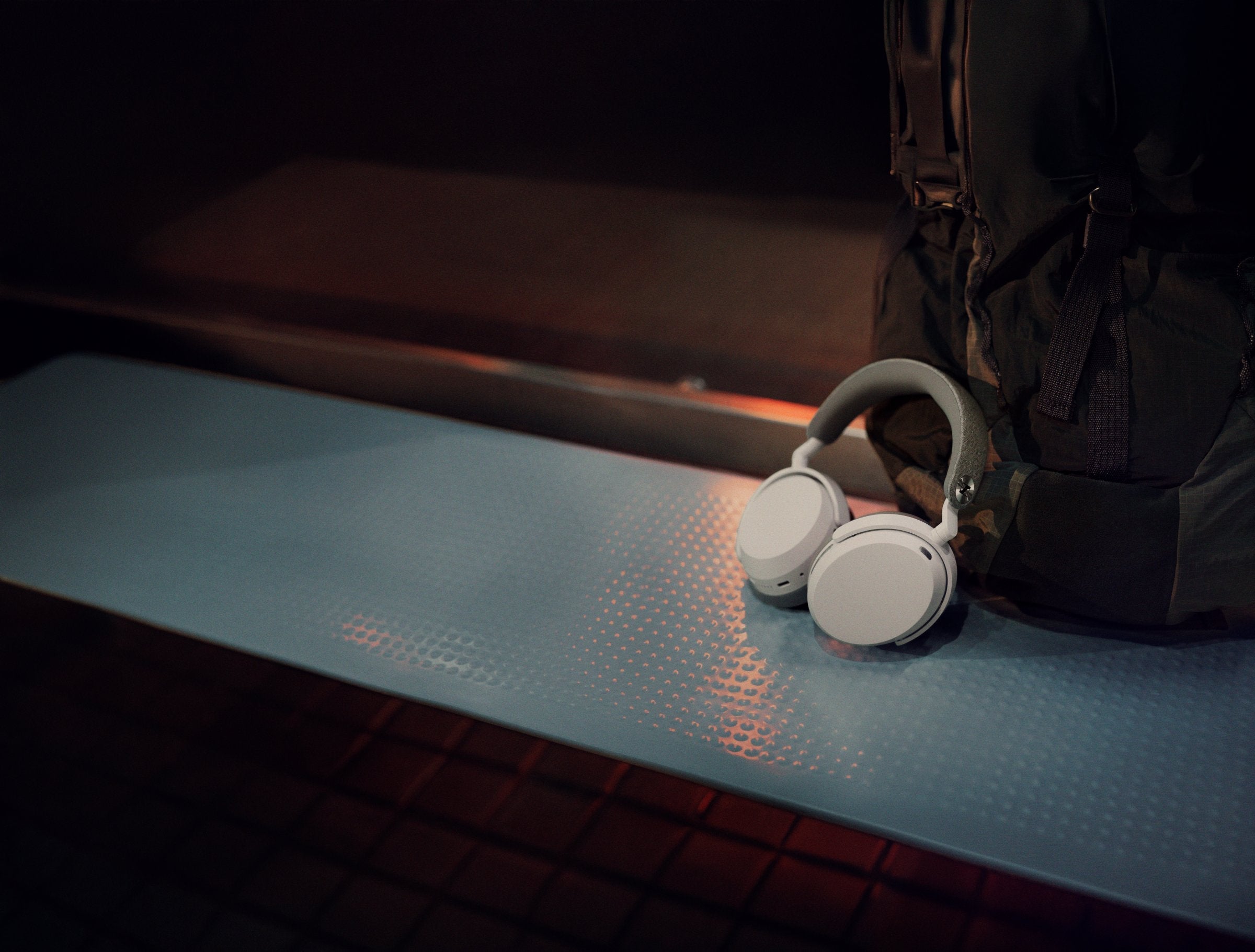Sennheiser MOMENTUM 5 Wireless Headphones White — outdoor lifestyle on bench