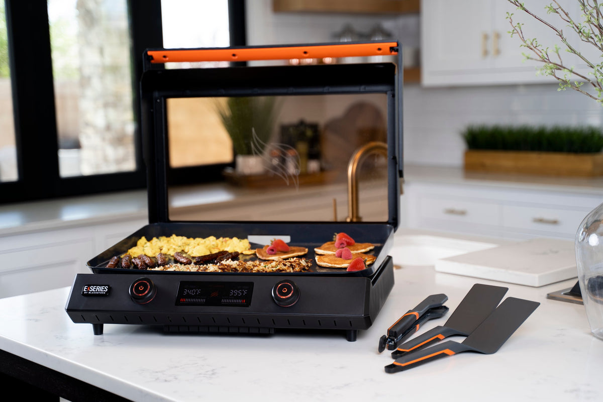 Blackstone E-Series 22" Electric Tabletop Griddle with Hood - Black - cooking with tools