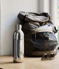 Aarke To-Go Bottle for Carbonator Pro, 500ml — lifestyle shot with backpack