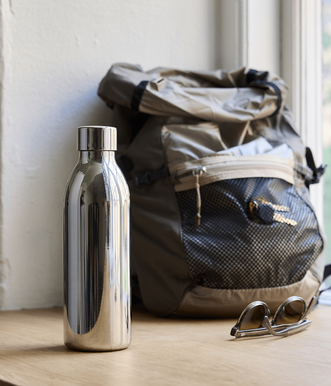 Aarke To-Go Bottle for Carbonator 3, 650ml — lifestyle shot with backpack