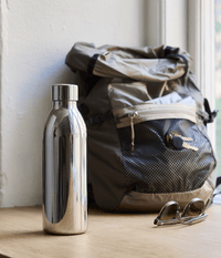 Aarke To-Go Bottle for Carbonator 3, 650ml — lifestyle shot with backpack