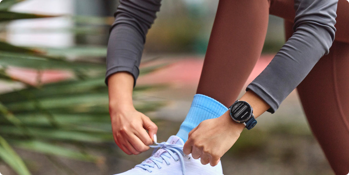 Amazfit Active 3 Premium 45mm Smartwatch - Atlas Blue - runner tying a shoe