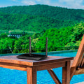 TP-Link Archer MR200, single unit on an outdoor poolside table — lifestyle
