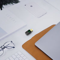 TP-Link Archer T2U AC600 Dual Band Wireless USB Adapter — desk flat-lay view