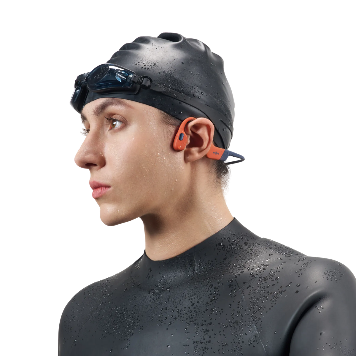 Shokz OpenSwim Pro Bone Conduction Swimming Headphones - Red - swimmer with cap and goggles
