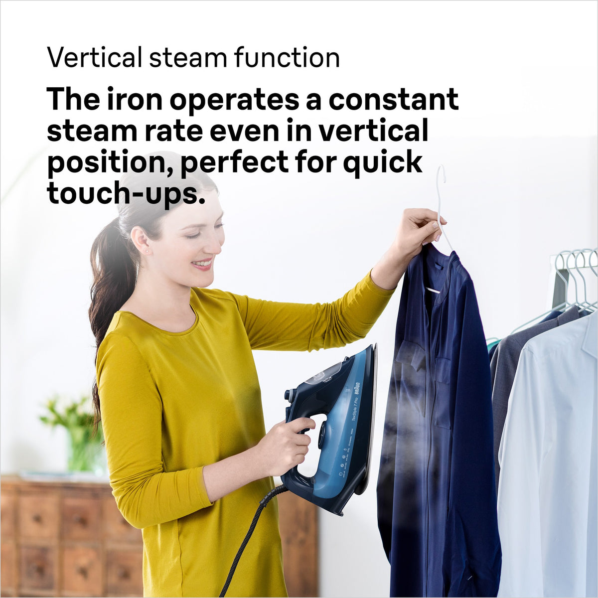 Braun TexStyle 7 Pro Steam Iron - Blue - vertical steaming in use