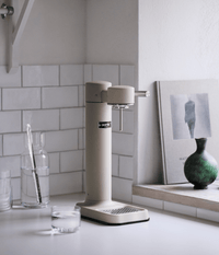 Aarke Carbonator 3 sparkling water maker in Sand — full front studio shot
