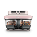 Ninja Crispi DualZone Glass Air Fryer in Rose Quartz with steak and roast vegetables in the two zones