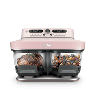 Ninja Crispi DualZone Glass Air Fryer in Rose Quartz with steak and roast vegetables in the two zones