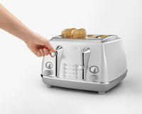 De'Longhi Icona Capitals 4 Slice Toaster - White - toasting bread with electronic controls