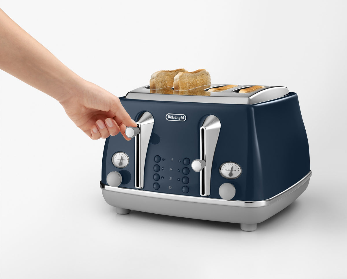 De'Longhi Icona Capitals 4 Slice Toaster - Blue - browning control and lift lever in use