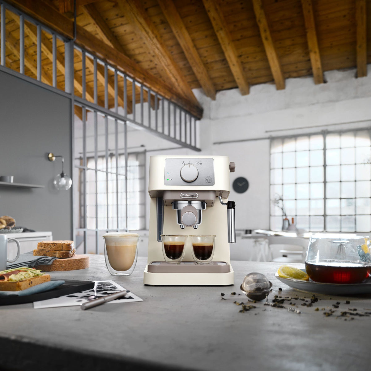 De'Longhi Stilosa Espresso Maker - Cream - in an open-plan kitchen with breakfast