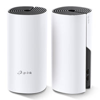 TP-Link Deco M4, two units — angled view showing one unit's port panel