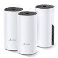 TP-Link Deco M4, three units — angled view showing one unit's port panel