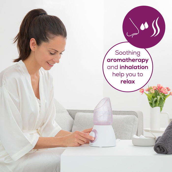 Beurer FS 60 Facial Sauna in use, woman using device with soothing aromatherapy and inhalation