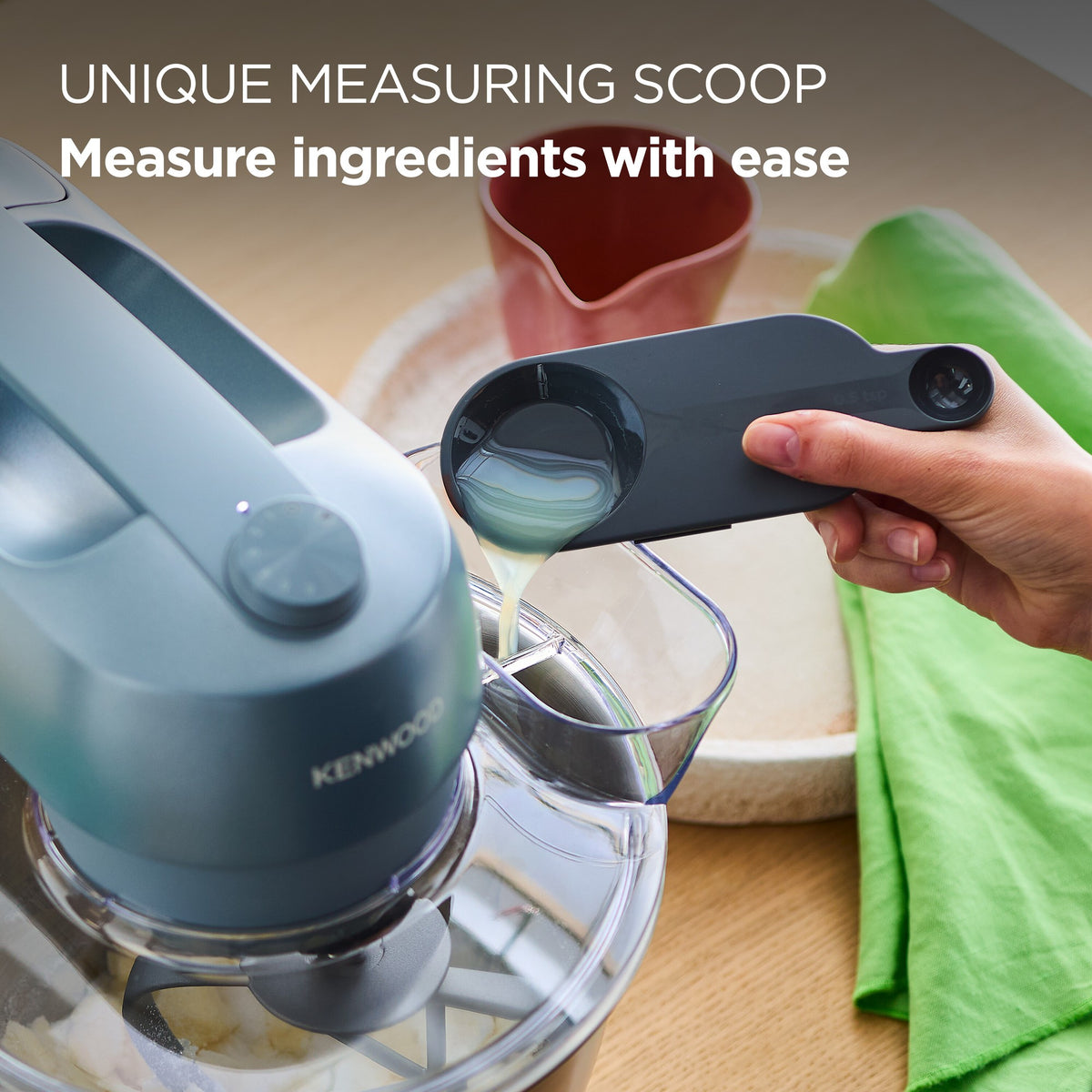 Kenwood Go Stand Mixer - Storm Blue - measuring scoop in the splashguard lid
