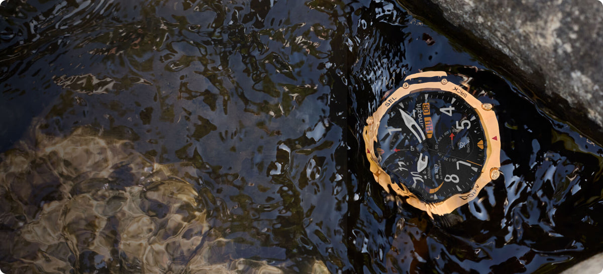 Amazfit T-Rex 3 Pro 48mm Smartwatch - Black Gold - submerged in a stream