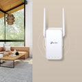 TP-Link RE315 AC1200 Wi-Fi Range Extender — minimal wall-mounted lifestyle view