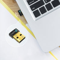 TP-Link UB500 Bluetooth 5.0 Nano USB Adapter — in-use, plugged into laptop