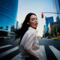Sennheiser ACCENTUM Clip Open-Ear Earphones Cream — lifestyle, worn while crossing a city street