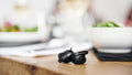 Sennheiser Conversation Clear Plus True Wireless Earphones — lifestyle, on a restaurant table