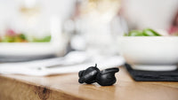 Sennheiser Conversation Clear Plus True Wireless Earphones — lifestyle, on a restaurant table