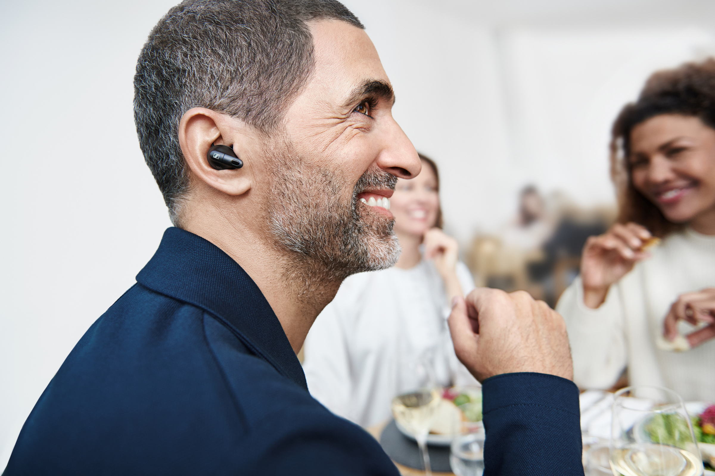 Sennheiser Conversation Clear Plus True Wireless Earphones — lifestyle, worn while dining
