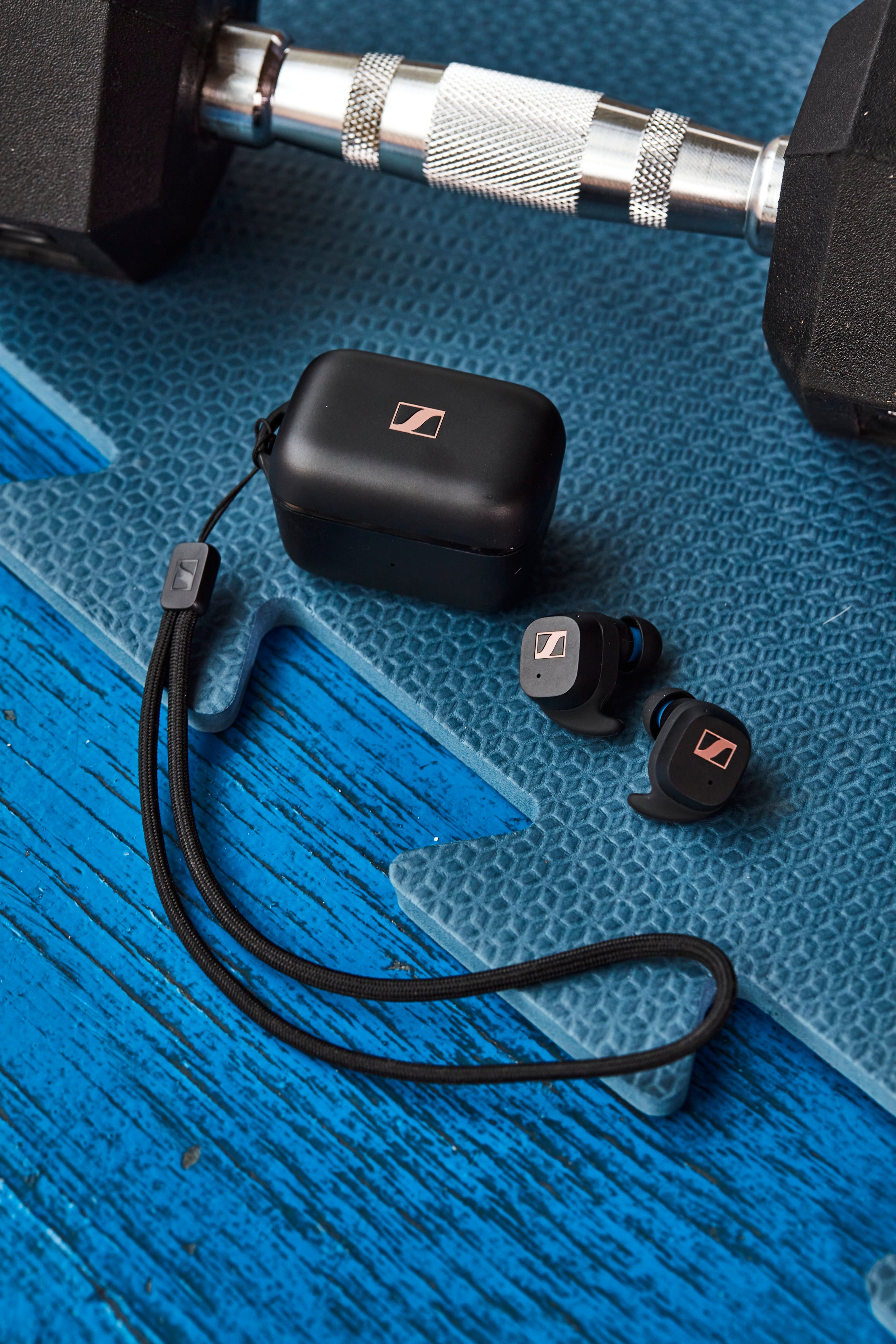 Sennheiser SPORT True Wireless Earphones Black — lifestyle flatlay with gym equipment