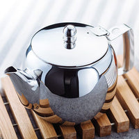Stellar Traditional Teapot ST06 lifestyle shot on wooden slat mat
