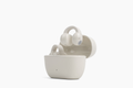 Sennheiser ACCENTUM Clip Open-Ear Earphones Cream — case standing with earbuds, front hero shot