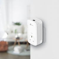 TP-Link TL-PA8010P KIT AV1300 Passthrough Powerline Kit — in-use, wall-mounted