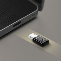 TP-Link TL-WN823N N300 Mini Wi-Fi USB Adapter, QSS button — in-use, plugged into laptop