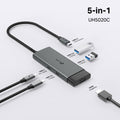 TP-Link UH5020C 5-in-1 USB-C hub with HDMI, PD & USB ports — hero shot labelled 5-in-1 with included cables shown