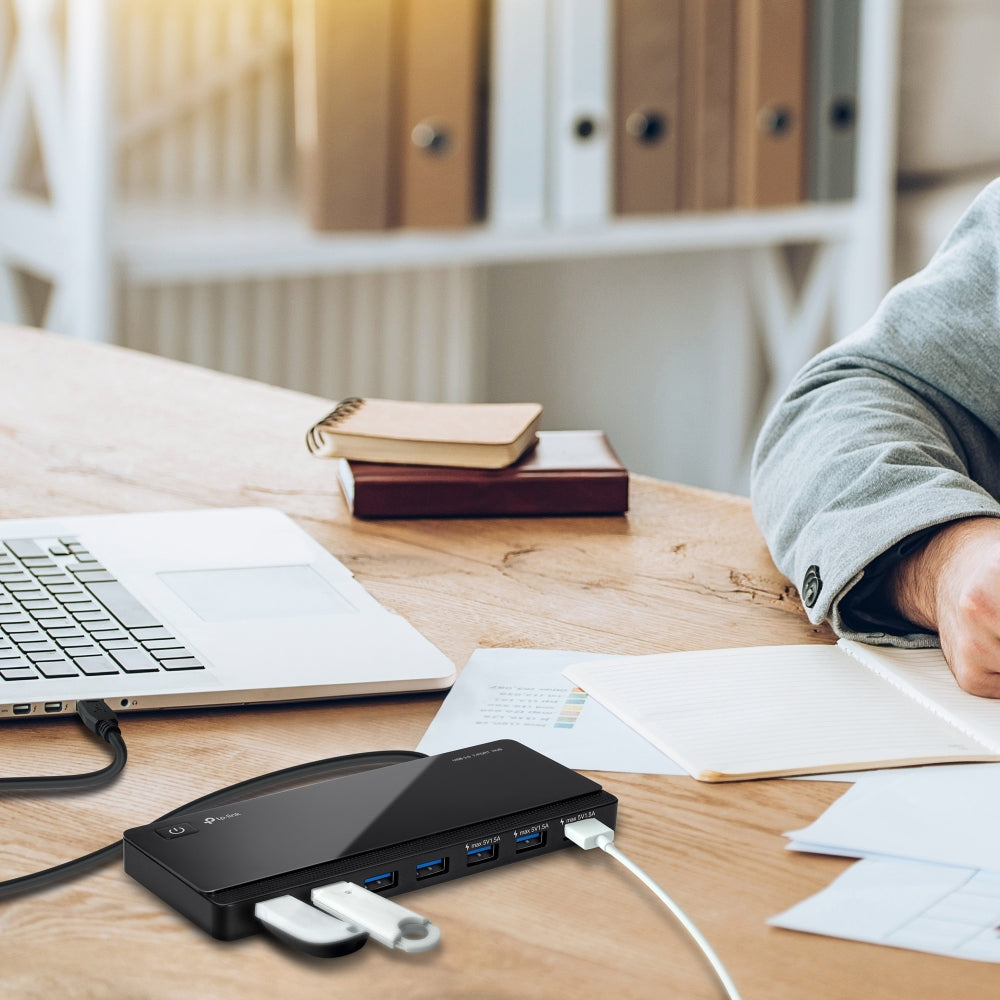 TP-Link UH700 USB 3.0 ports, data transfer rate of up to 5Gbps — in-use on desk with laptop and cables