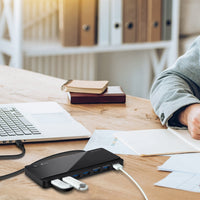 TP-Link UH700 USB 3.0 ports, data transfer rate of up to 5Gbps — in-use on desk with laptop and cables