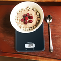 Beurer KS 19 Kitchen Scale Black in use, bowl of food on scale showing weight in oz