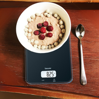Beurer KS 19 Kitchen Scale Black in use, bowl of food on scale showing weight in oz