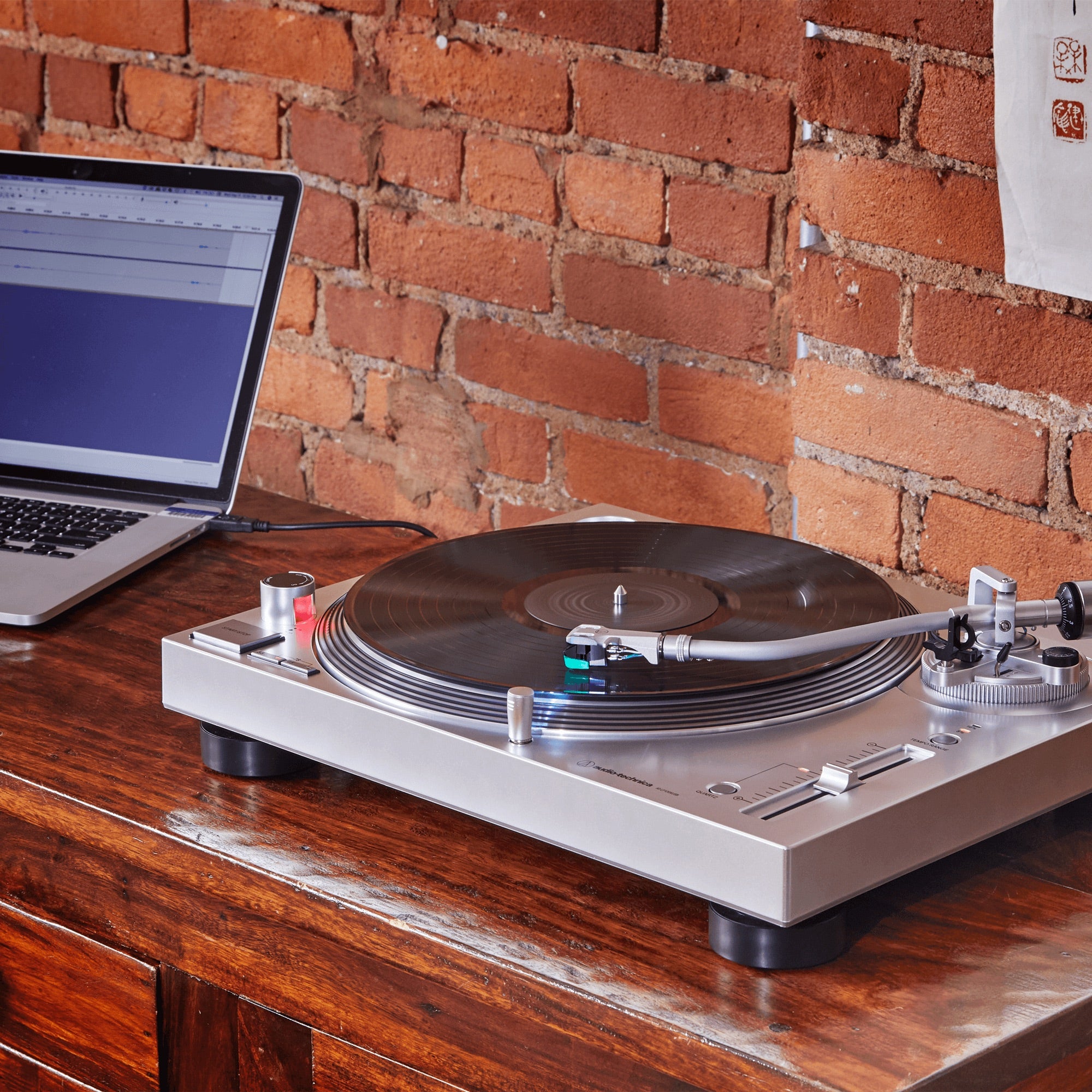 Audio-Technica AT-LP120XUSB silver turntable lifestyle view