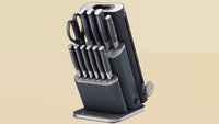 Ninja StaySharp 13-Piece Knife Block in Black, angled product shot on tan background