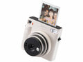 FUJIFILM instax SQUARE SQ1 Instant Camera Chalk White - front three-quarter view with print