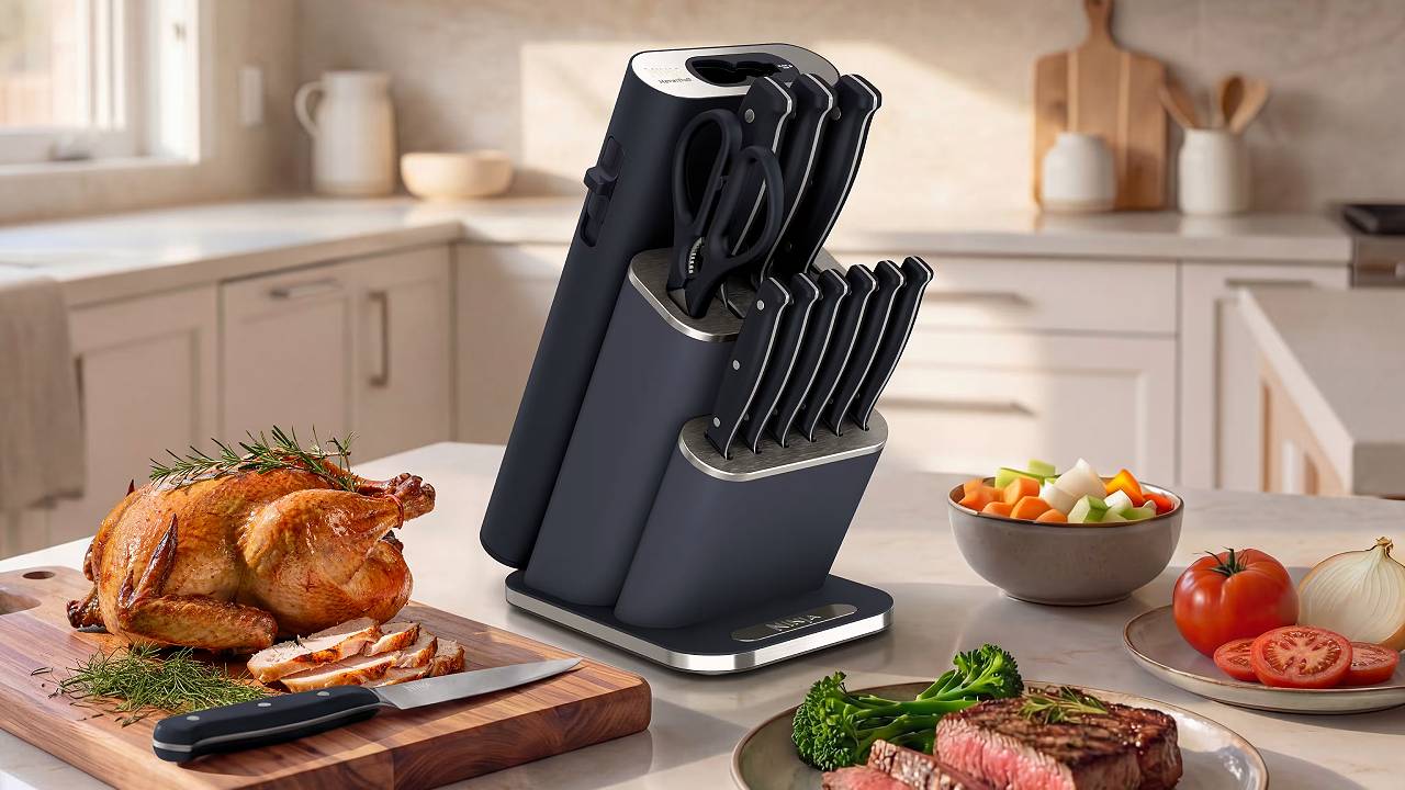 Ninja StaySharp 13-Piece Knife Block in Black on a kitchen counter with a carved turkey