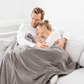 Beurer HD 150 XXL Heated Overblanket 200x150cm Taupe, couple relaxing under blanket on sofa