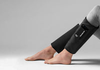 Hyperice Normatec Lower Legs shown in use on the calf