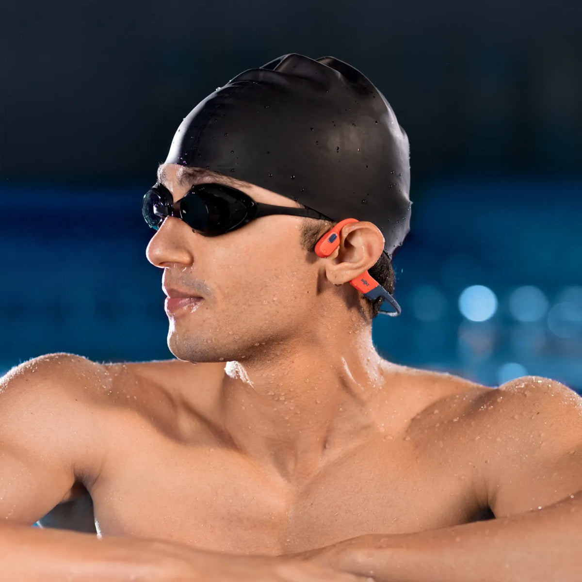 Shokz OpenSwim Pro Bone Conduction Swimming Headphones - Red - at the pool edge