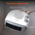 Warmlite WL44004 flat fan heater in white with hand adjusting the dial controls