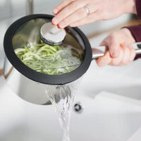 Stellar Stay Cool 4 Piece Draining Saucepan Set SLB2 lifestyle draining-lid action shot